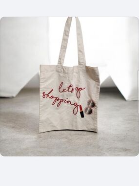 Cream Canvas Tote Bag with 'let's go shopping' Script
